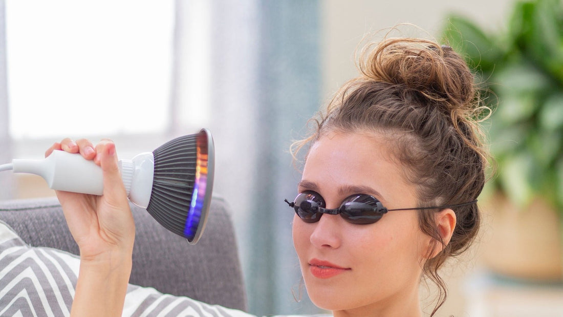Woman wearing protective glasses during a Hooga light therapy session